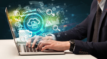 Business hand typing on a modern laptop