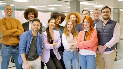 Group of colleagues smiling at camera in a coworking space