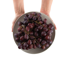 Hand holding plate with purple grapes and transparent background png