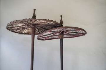 Old traditional Javanese umbrellas made of wood and paper, usually used in cultural and religious...