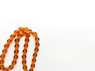 Orange Tasbih - Muslim Prayer Beads isolated on white background 