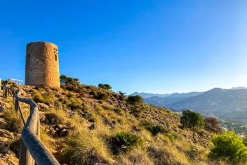 Rideaux tamisants Cerro Torre Sunset over Mediterranean sea. Historic Torre Vigia De Cerro Gordo, a watchtower looking out for any marauding pirates. La Herradura, Andulasia, Southern Spain