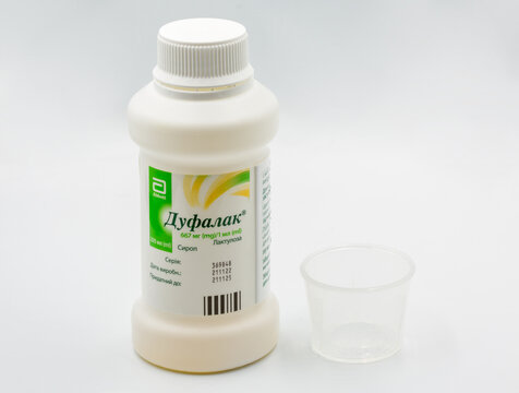 Duphalac lactulose laxative syrup by Abbott pack closeup against white.