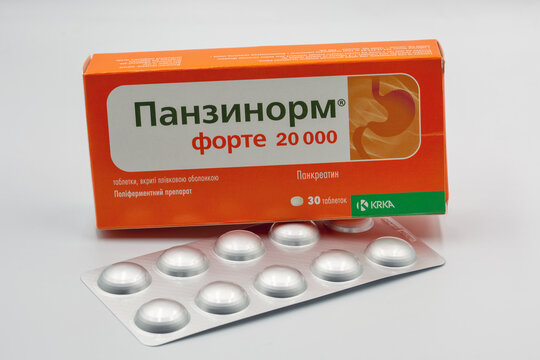 Panzynorm pancreatin pack and blister closeup against white.