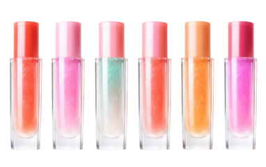 A colorful assortment of lip glosses arranged in a row, featuring various shades from subtle nudes to bold pinks and reds
