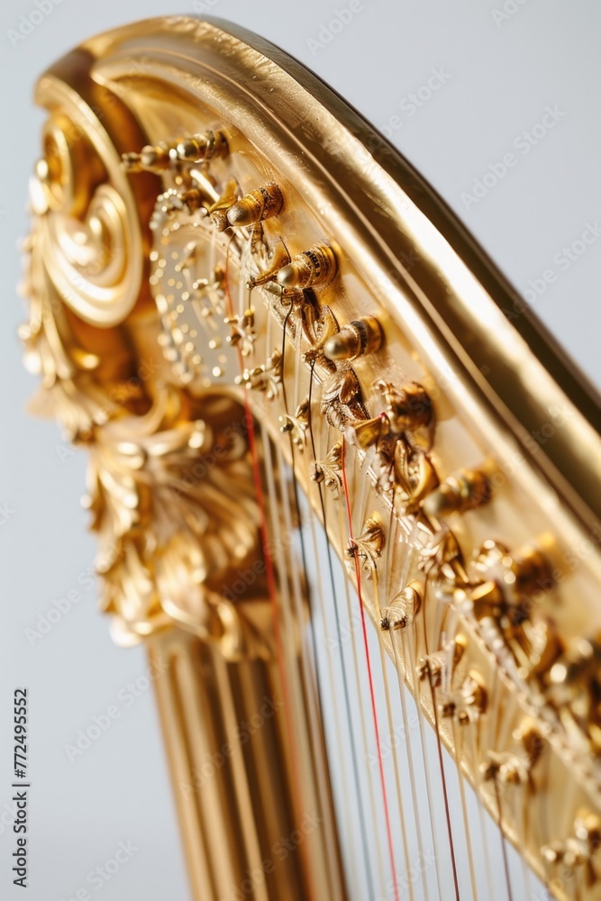 Poster Detailed image of a golden harp with strings. Ideal for music-themed designs