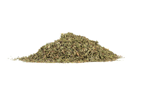A bunch of dried thyme leaves on a white background.