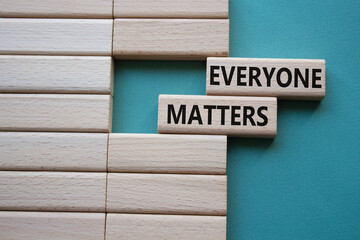 Everyone matters symbol. Concept words Everyone matters on wooden blocks. Beautiful grey green background. Business and Everyone matters concept. Copy space.