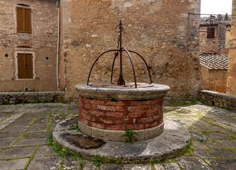 characteristic stone well in a Tuscan village