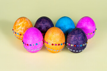 Seven isolated colored and decorated Easter eggs
