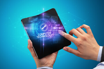 Businessman holding a foldable smartphone, technology concept