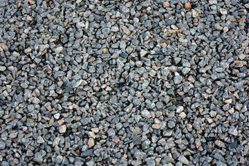 Construction, building materials, gray construction crushed stone poured on one large pile.