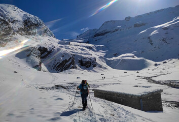 Fototapeta na wymiar Snowshoers in the snowy mountains