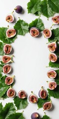 Fresh figs with green leaves on white. Top view, copy space for text.
