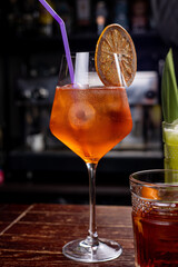 Close-up of woman's hand holding a glass of cocktail.