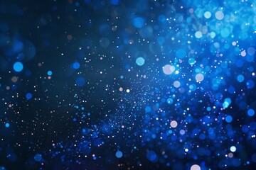 Abstract blue background with bokeh lights and glittering particles. Festive and magical, perfect for Christmas or holiday-themed designs