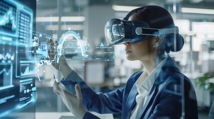 a woman wearing a virtual headset looking at a screen with a lot of data on it - 772525734