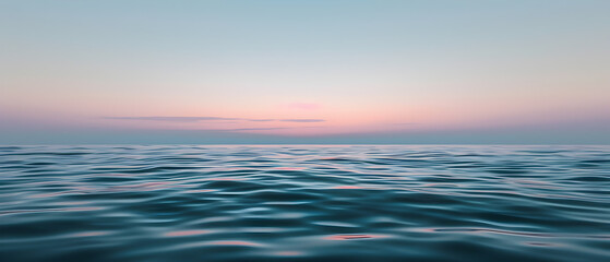 Fototapeta na wymiar Soft waves of the ocean under a gradient sunset sky from pink to blue, evoking calm and peace
