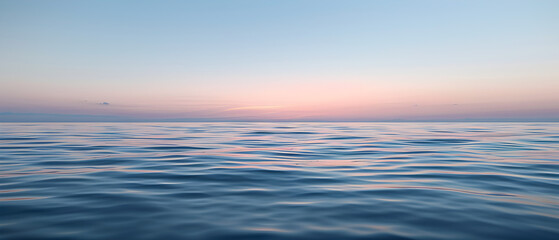 Fototapeta na wymiar An expansive ocean view under a soft sunrise sky, blending hues of pink and blue