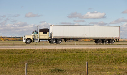 Heavy Cargo on the Road. A truck hauling freight along a highway. Taken in Alberta, Canada