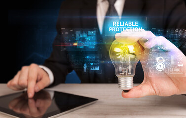 Businessman holding a light bulb, online security concept