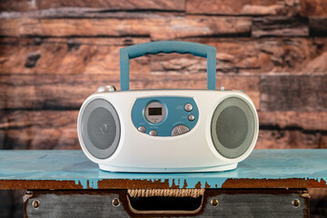 vintage radio and compact disc player isolated on blue