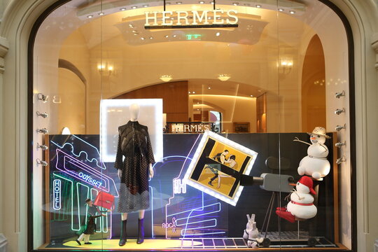 MOSCOW, RUSSIA - JANUARY 9, 2022: Creative show window, store display of Hermes boutique shop in GUM department store in Moscow city (State Department Store). Neon art in show windows. Hermes fashion