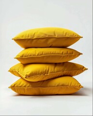 Obraz premium A stack of four yellow pillows against a white background in product photography with studio lighting creating soft shadows and high resolution photography with professional color grading and sharp