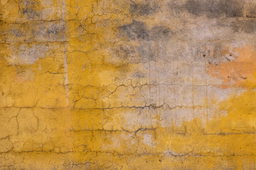 Old wall with yellow plaster