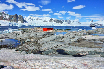 View of Petermann Island in Antarctica with the research station on the horizon