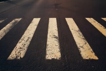 Faded road markings tell tales of journeys past and present - obrazy, fototapety, plakaty