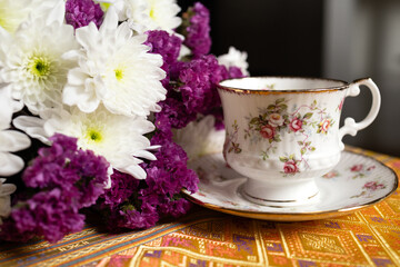 English china vintage cup with a fresh cut bouquet
