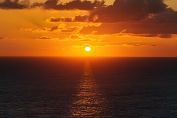 Obraz premium Publish Aerial view of golden sunset sky over the sea