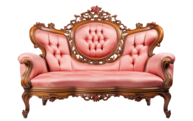 A pink couch adorned with gold trimmings and a wooden frame