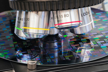 Close up examining test sample microchip transistor under microscope in laboratory. Equipment for...