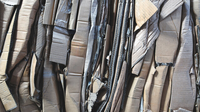 folded paper and cardboard waste paper collected for recycling, recycle concept background