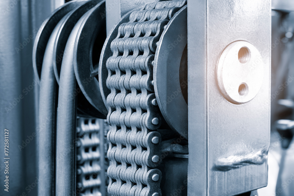 Poster a chain is shown in a black and silver color of warehouse forklift. the chain is made of metal and h