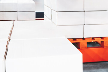 modern distribution warehouse with boxes on racks