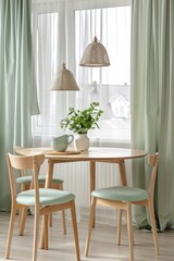 Cozy dining space with two mint chairs and wooden table under natural light