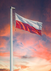 National state flag of Poland and stormy sunset sky