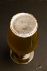 a glass glass with an alcoholic drink in close-up