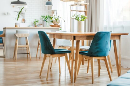 Stylish Scandinavian dining room with a wooden table and blue chairs