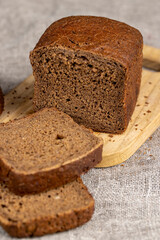 rectangular loaf of bread on a linen cloth