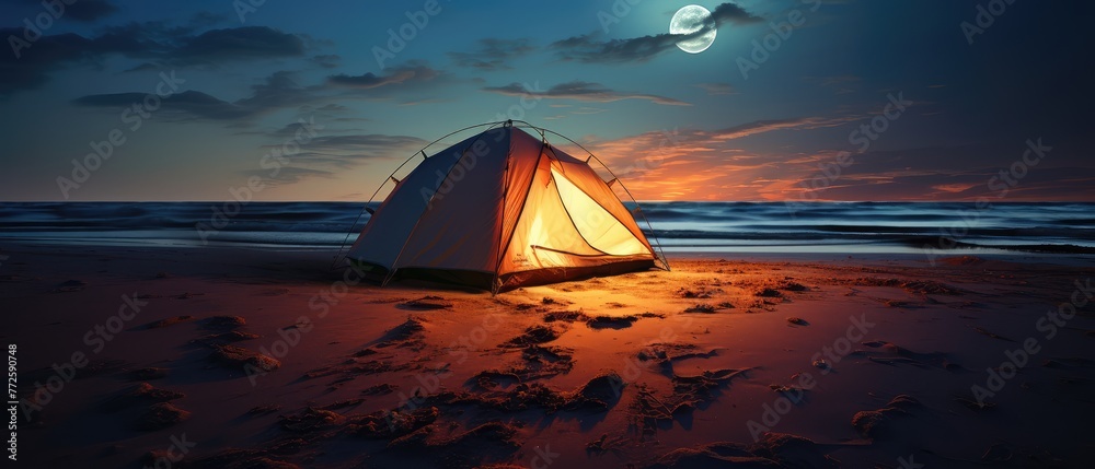 Wall mural Illuminated Tent on a Beach Under Moonlight