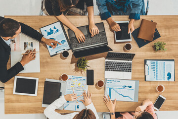 Top view of businessman executive in group meeting with other businessmen and businesswomen in...