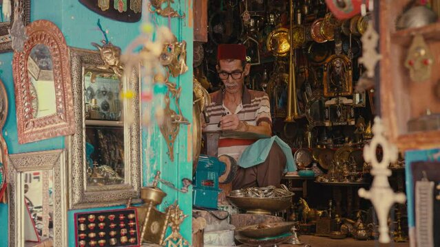 Shot of Morocco Man in a Store Engraving brassware