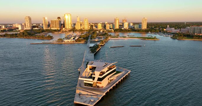 Sunrise at Saint Petersburg, Florida pier with downtown skyline in the background, aerial perspective.