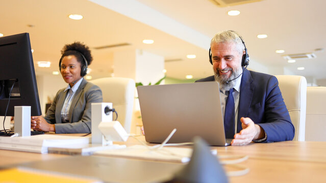 Mature businessman having an online business meeting with his client