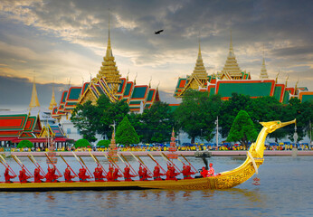 Traditional Thai Boat Procession under Partly Cloudy Skies, Golden Barge with Rowers in Bangkok
