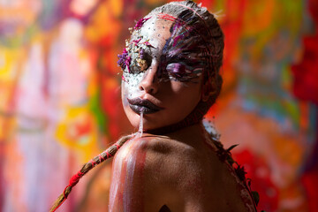 Art nude Portrait of young woman with art make-up. The Body Art. Abstract face paint. Sexy Model...